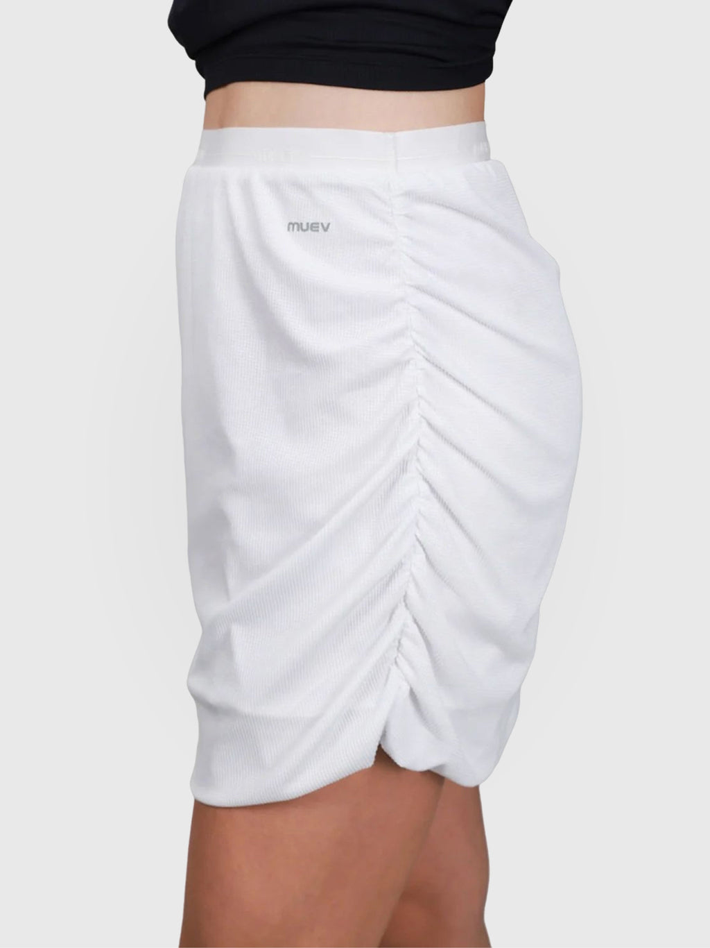 Side view of White Airy Twist Skort by MUEV designed as lightweight pickleball skort with ruched detail