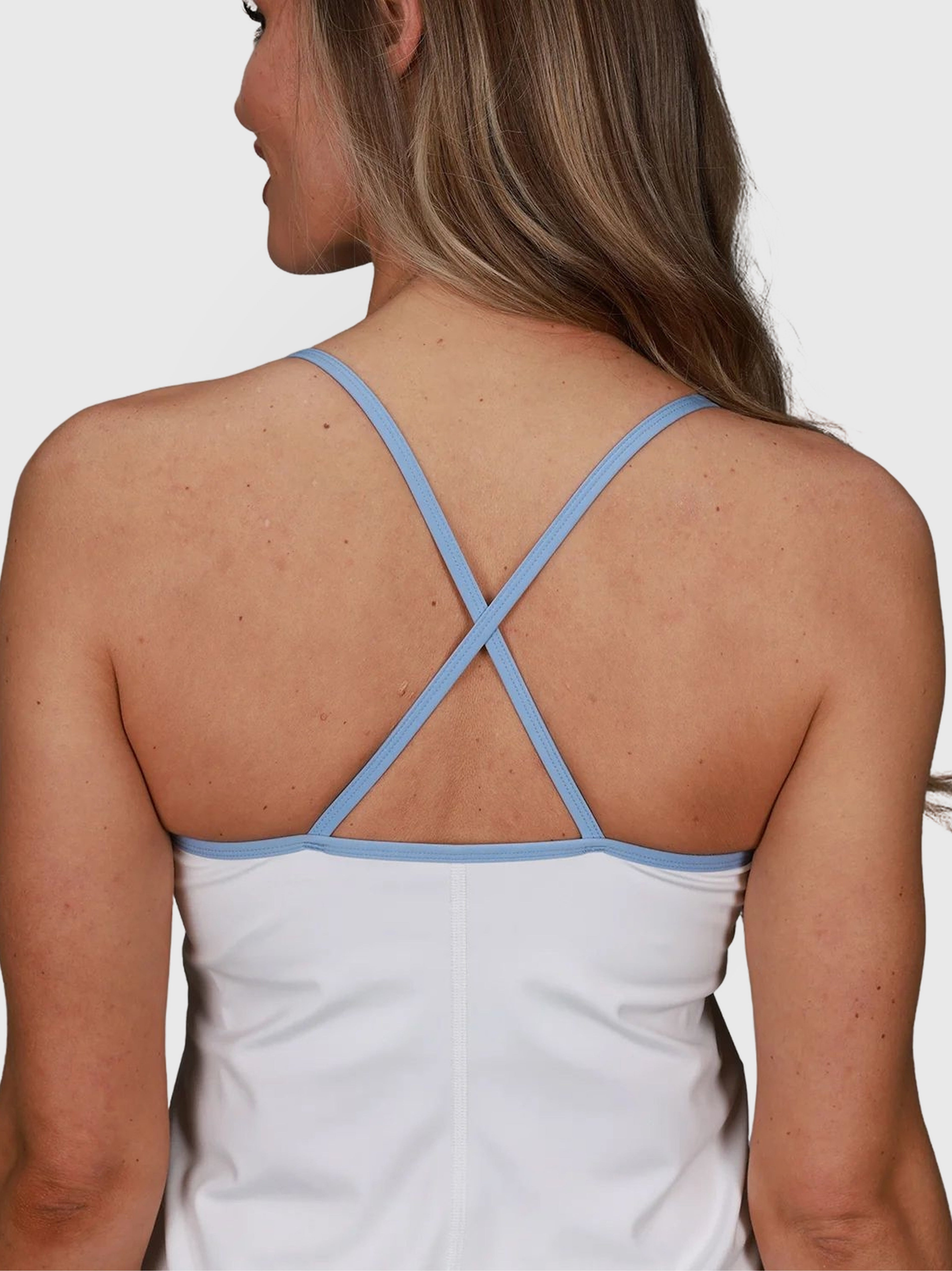 back view of Double V Dress in white with light blue straps by MUEV for pickleball apparel