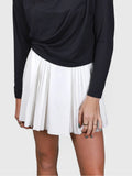 Front view of white Flutter Skort with pleated design by MUEV for padel and pickleball clothing