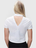 Back view of white Open Back Polo by MUEV designed for padel and pickleball clothing with a deep V cutout