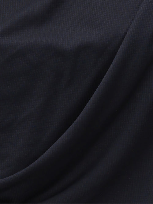 Close-up of black Airy Twist Long Sleeve fabric texture by MUEV for padel and pickleball apparel
