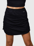 Front view of black Airy Twist Skort by MUEV featuring ruched sides for padel and pickleball apparel
