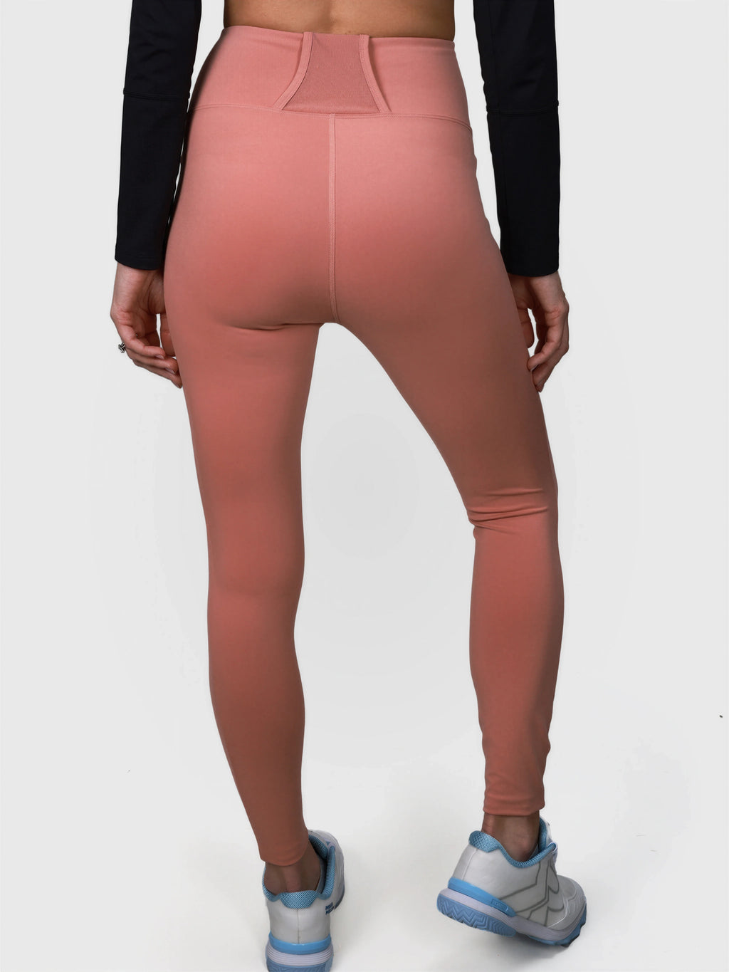 Back view of dusty pink Court Legging in padel and pickleball clothing by MUEV with high waistband design