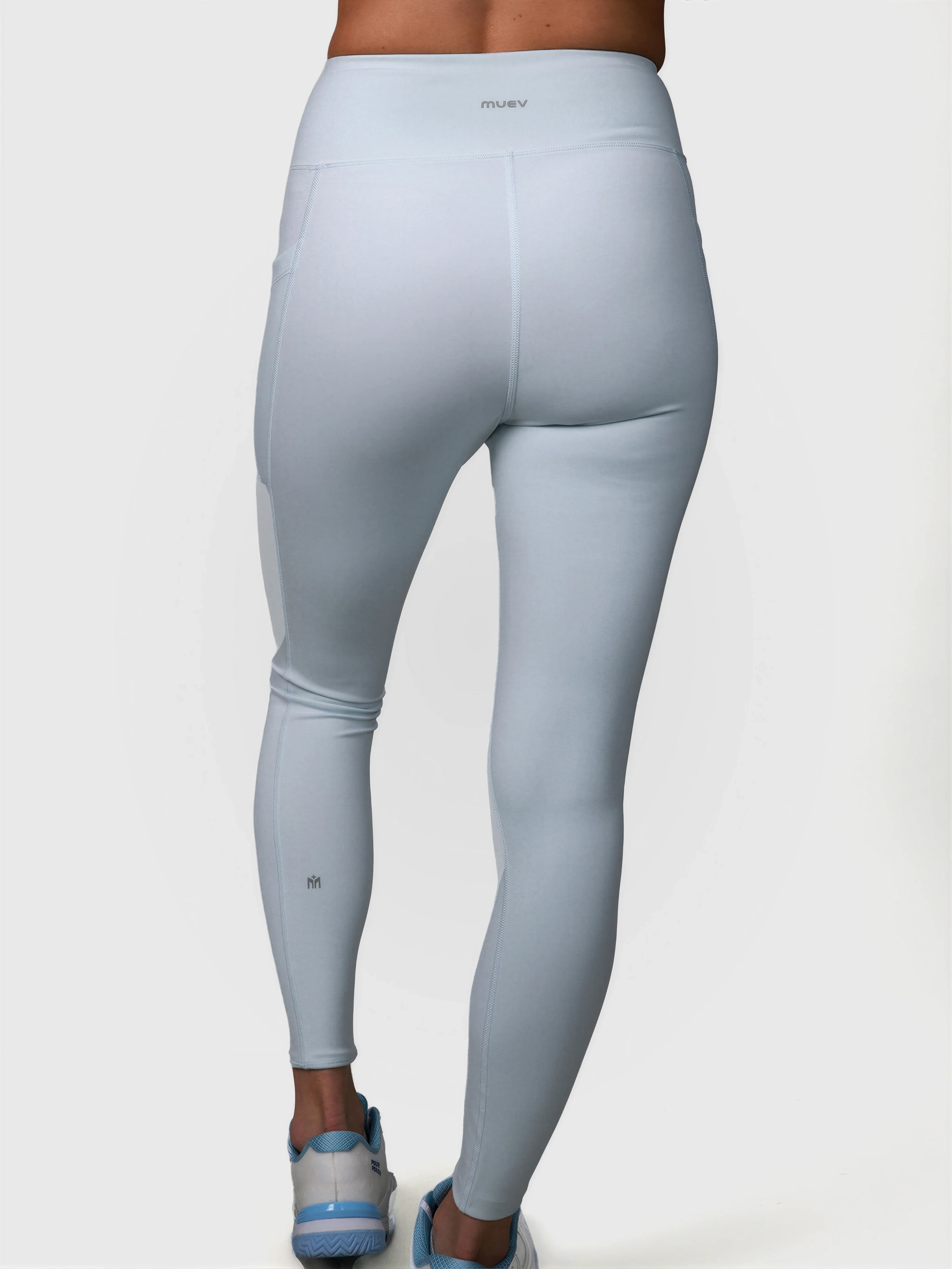 Rear view of ice blue V Cross Over Leggings by MUEV for padel and pickleball apparel with a high waist design