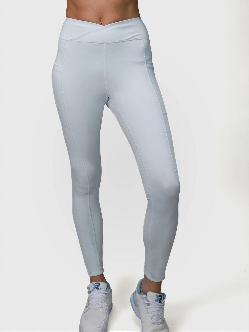 Front view of ice blue V Cross Over Leggings by MUEV designed for padel and pickleball apparel