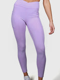 front view of woman wearing lavender V Cross Over Leggings by MUEV for padel and pickleball apparel