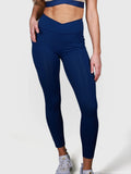 front view of woman wearing navy V Cross Over Leggings by MUEV for padel and pickleball apparel