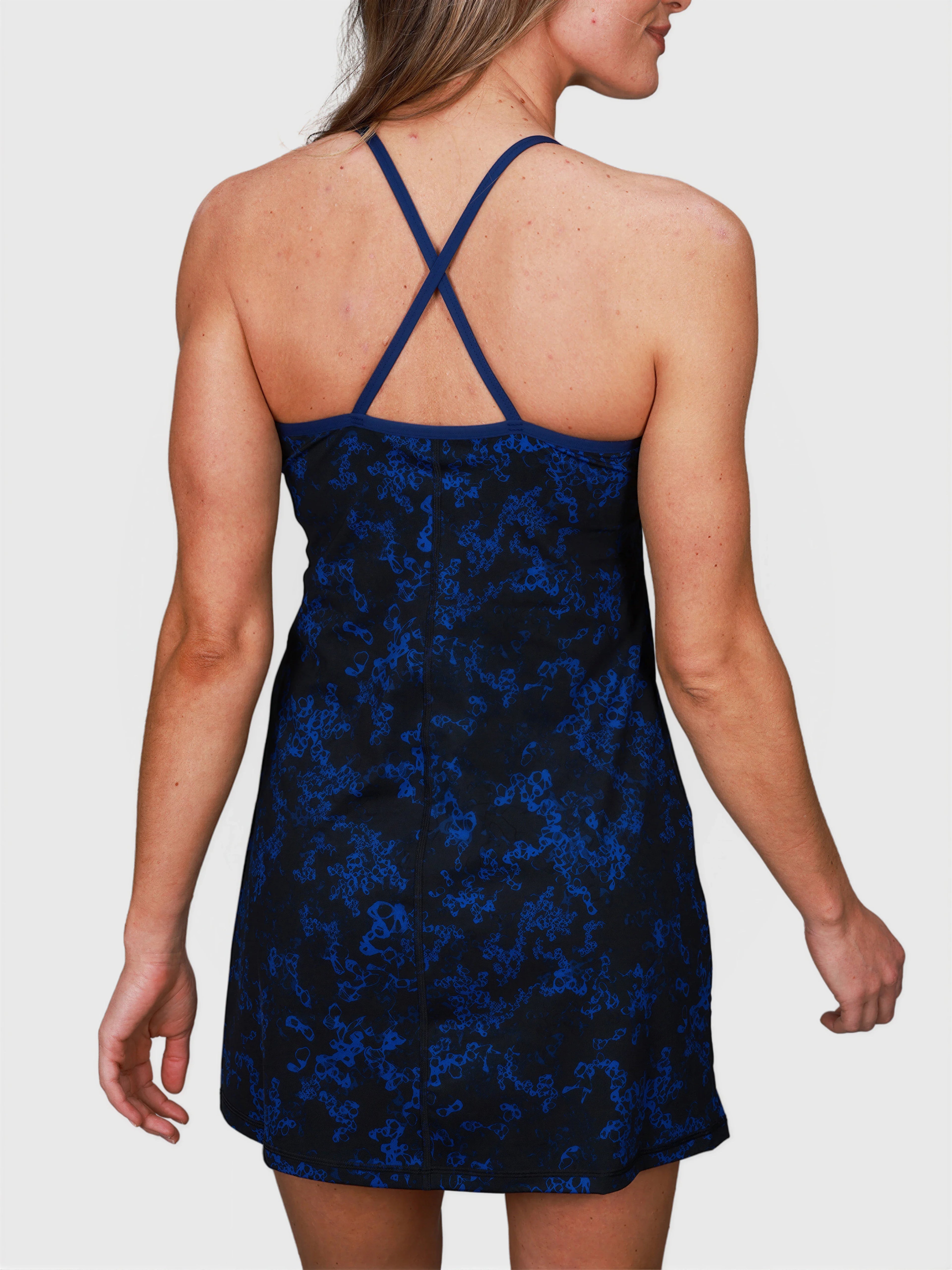 back view of Double V Dress in Blue Sakura pattern with crossed straps by MUEV for padel and pickleball clothing