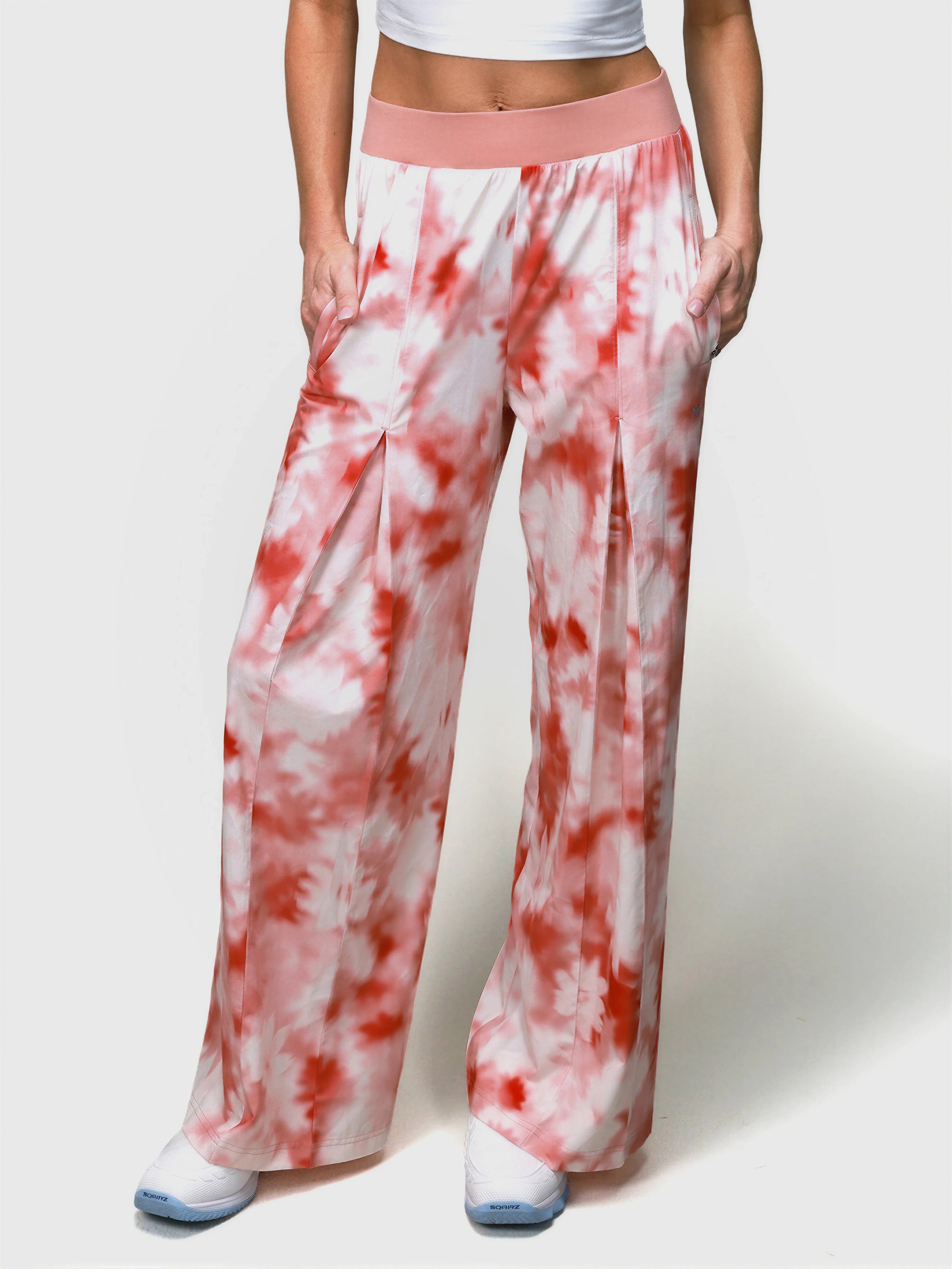 Front view of pink petal tie-dye Grace Pleated Pant by MUEV with wide legs and elastic waistband for padel apparel