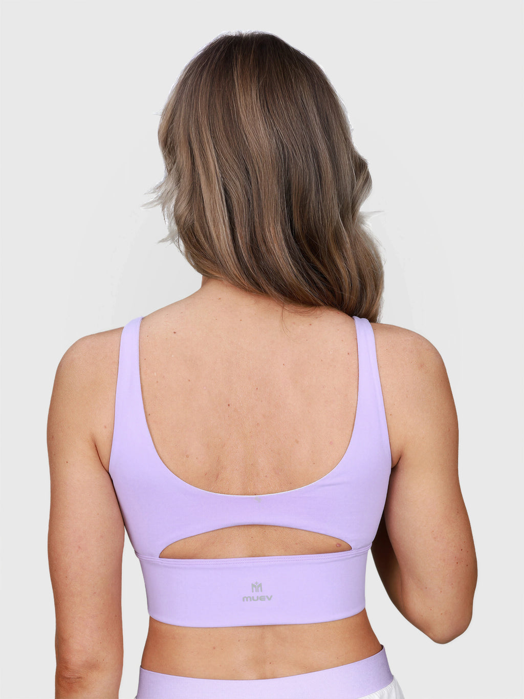 back view of lilac Long Line Sports Bra with cutout detail by MUEV for padel and pickleball apparel