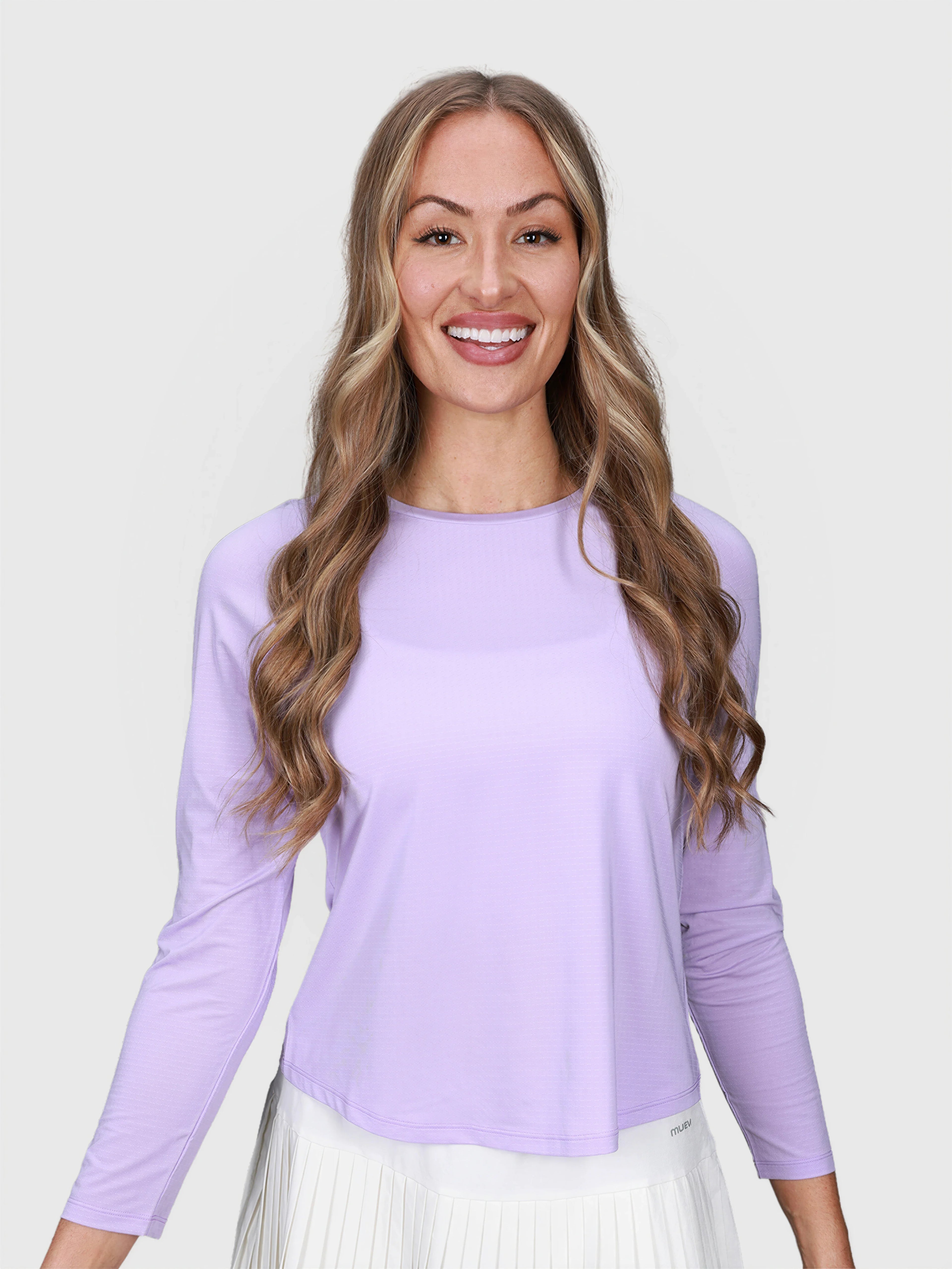 woman smiling wearing lilac Performance Long Sleeve top by MUEV for padel and pickleball apparel
