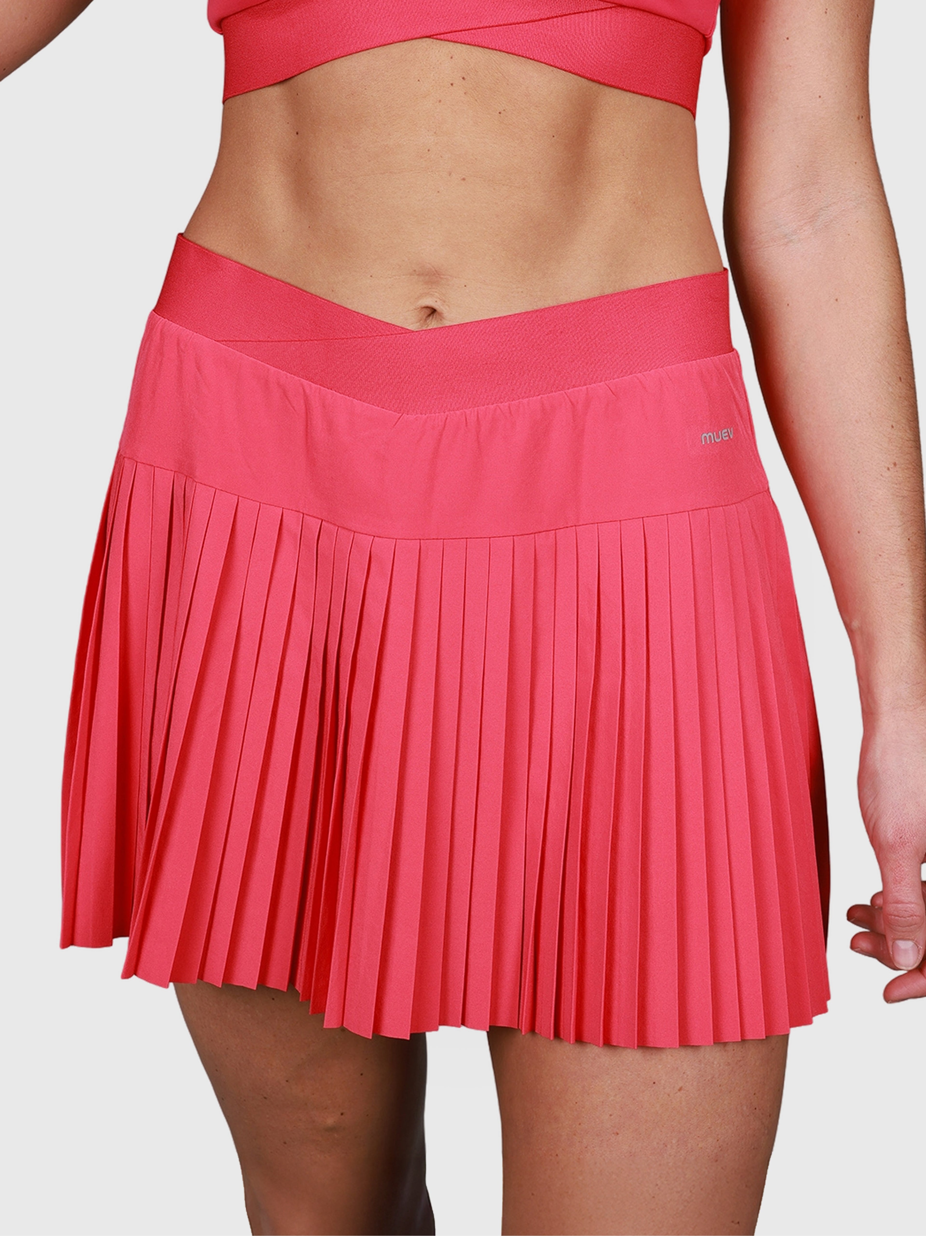 front view of pink Performance Pleated Skort by MUEV designed for padel and pickleball apparel