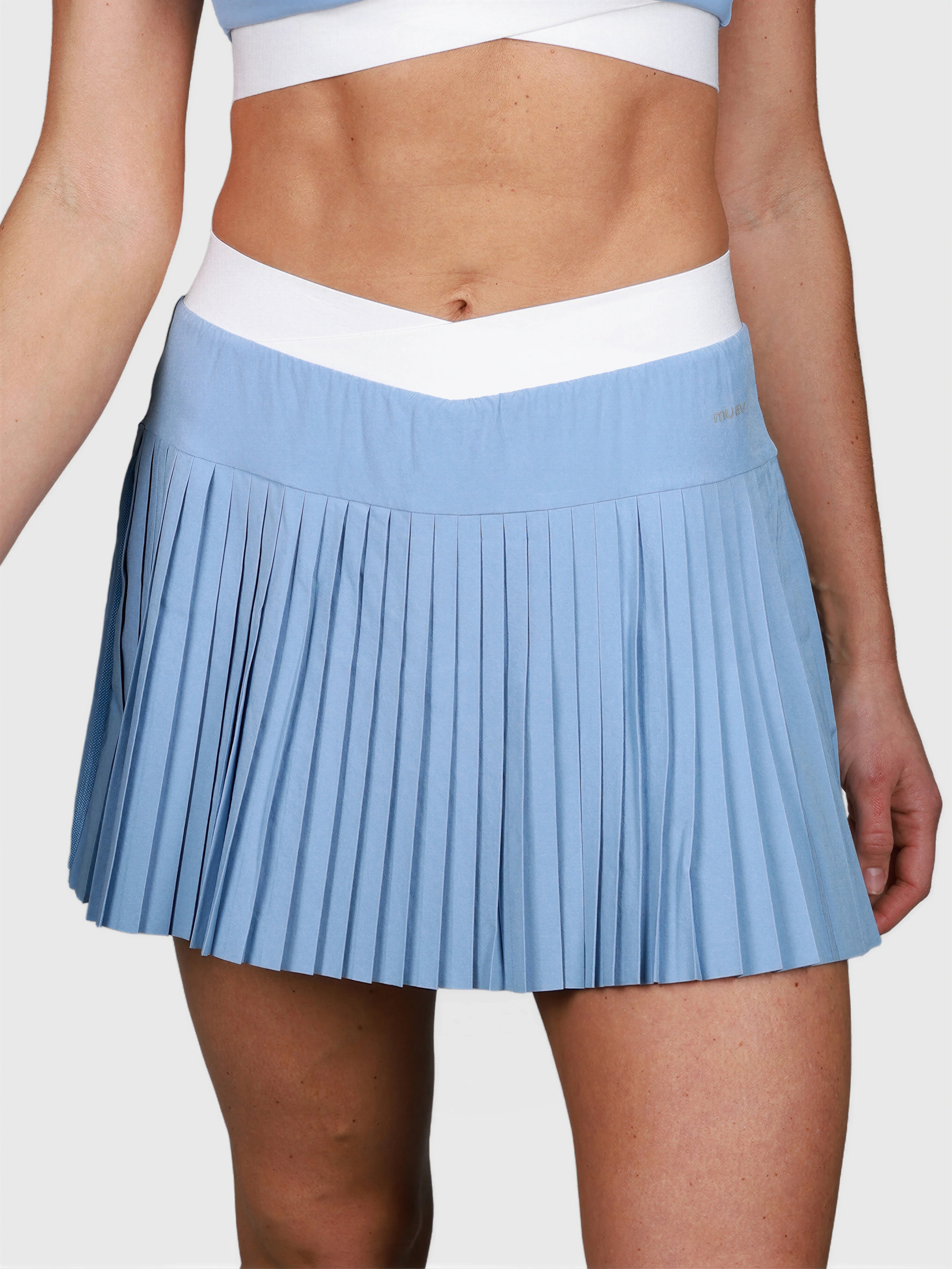 front view of cloud blue Performance Pleated Skort with white waistband by MUEV for padel and pickleball clothing