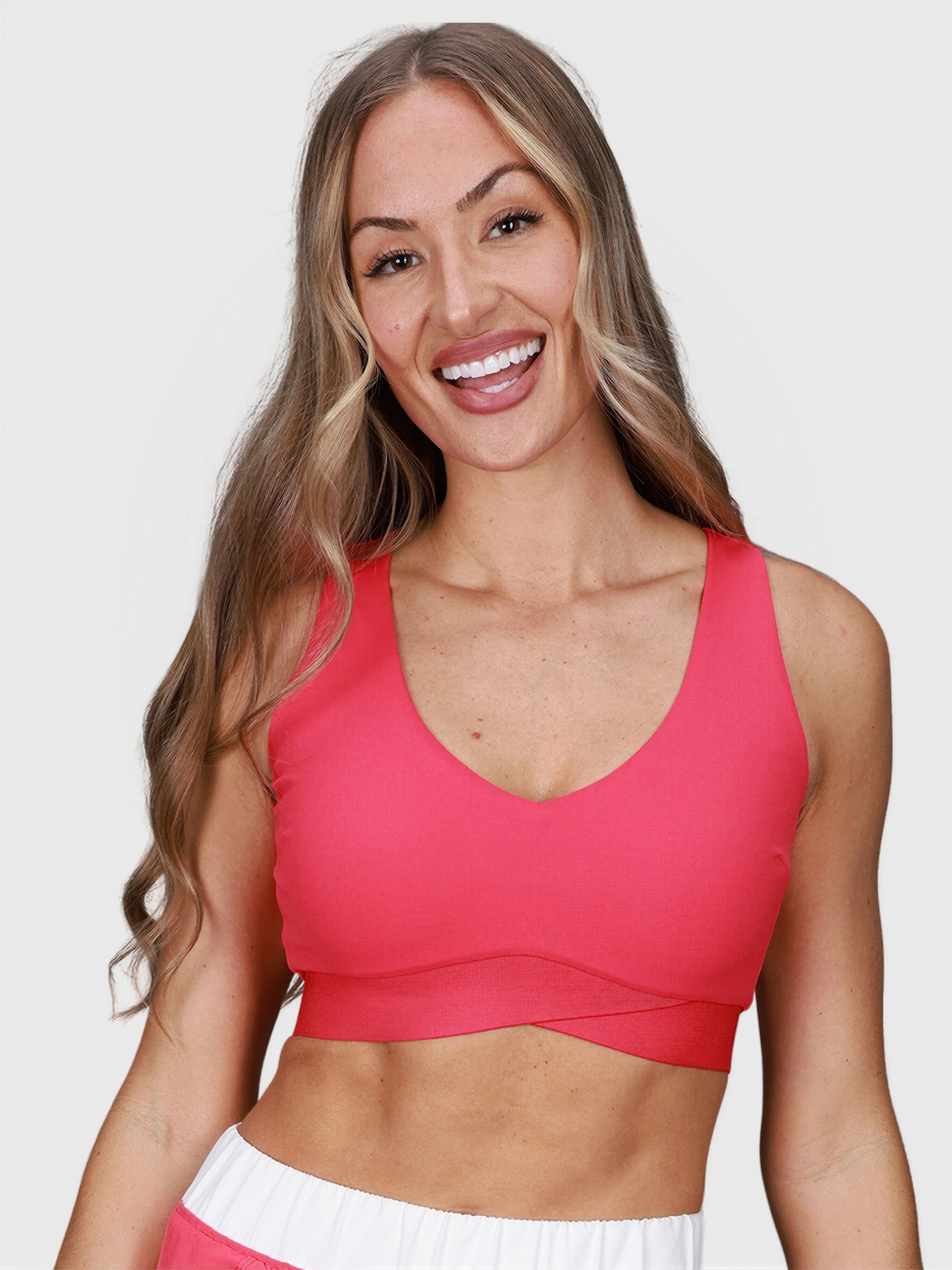 woman wearing pink V Neck Tanklette Crop by MUEV designed for padel and pickleball apparel