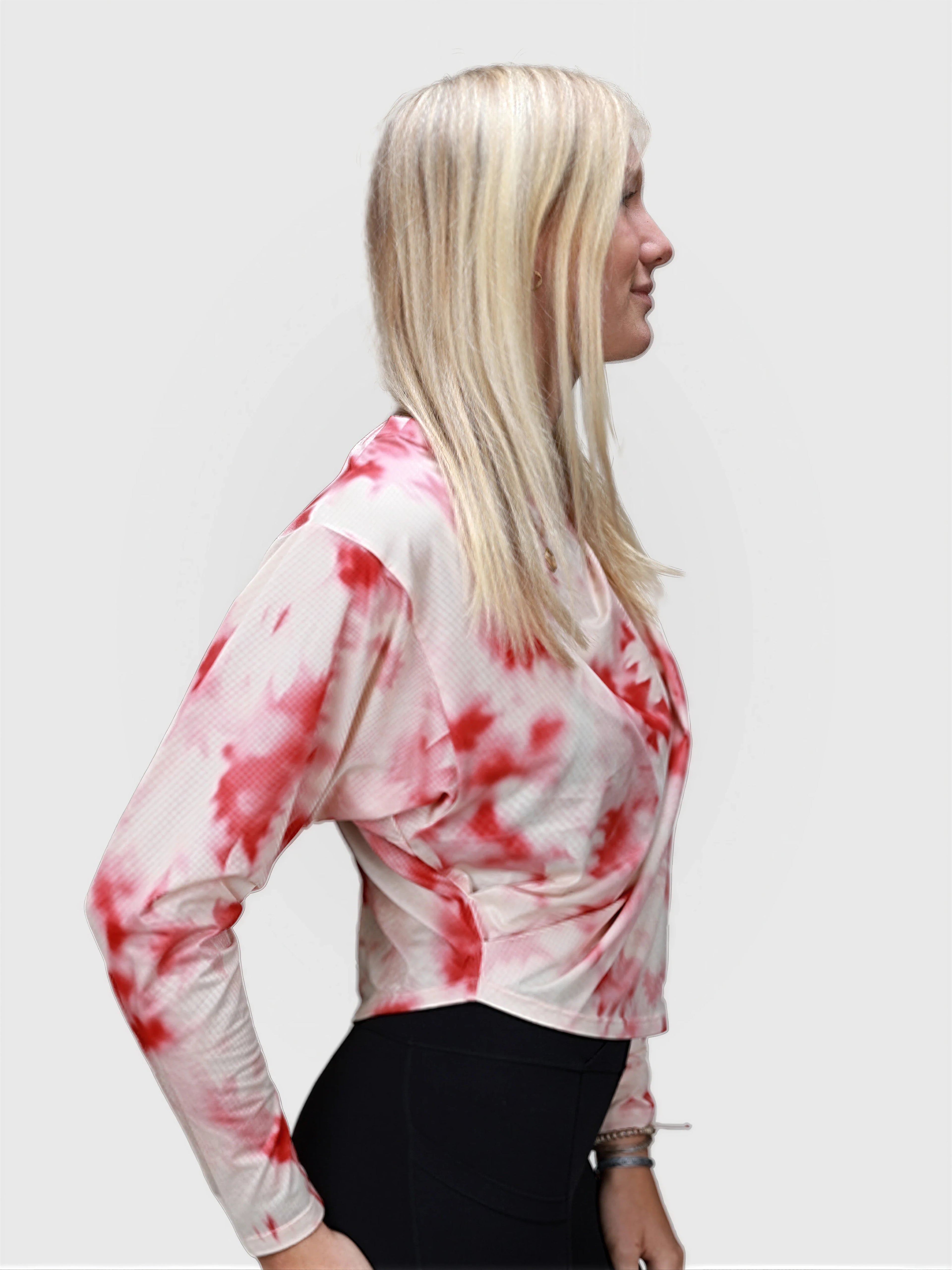 Woman wearing pink petal Airy Twist Long Sleeve by MUEV styled for pickleball and padel apparel