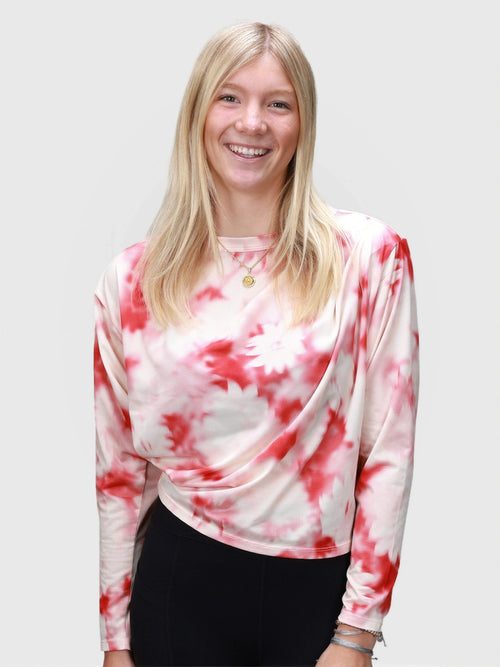 Woman wearing pink petal Airy Twist Long Sleeve by MUEV styled for pickleball and padel clothing