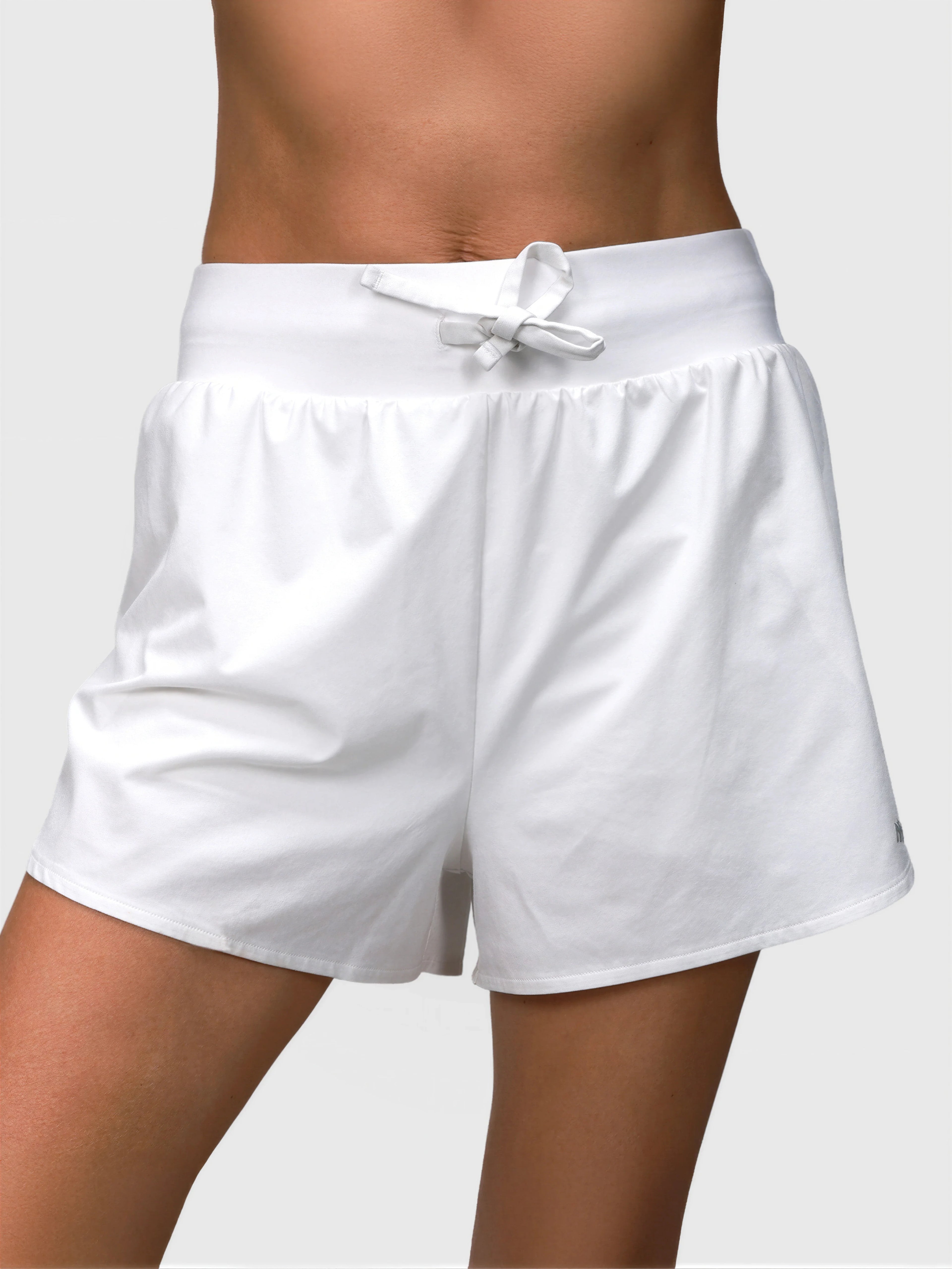 Front view of white Tulip Compression Short by MUEV designed for pickleball and padel apparel