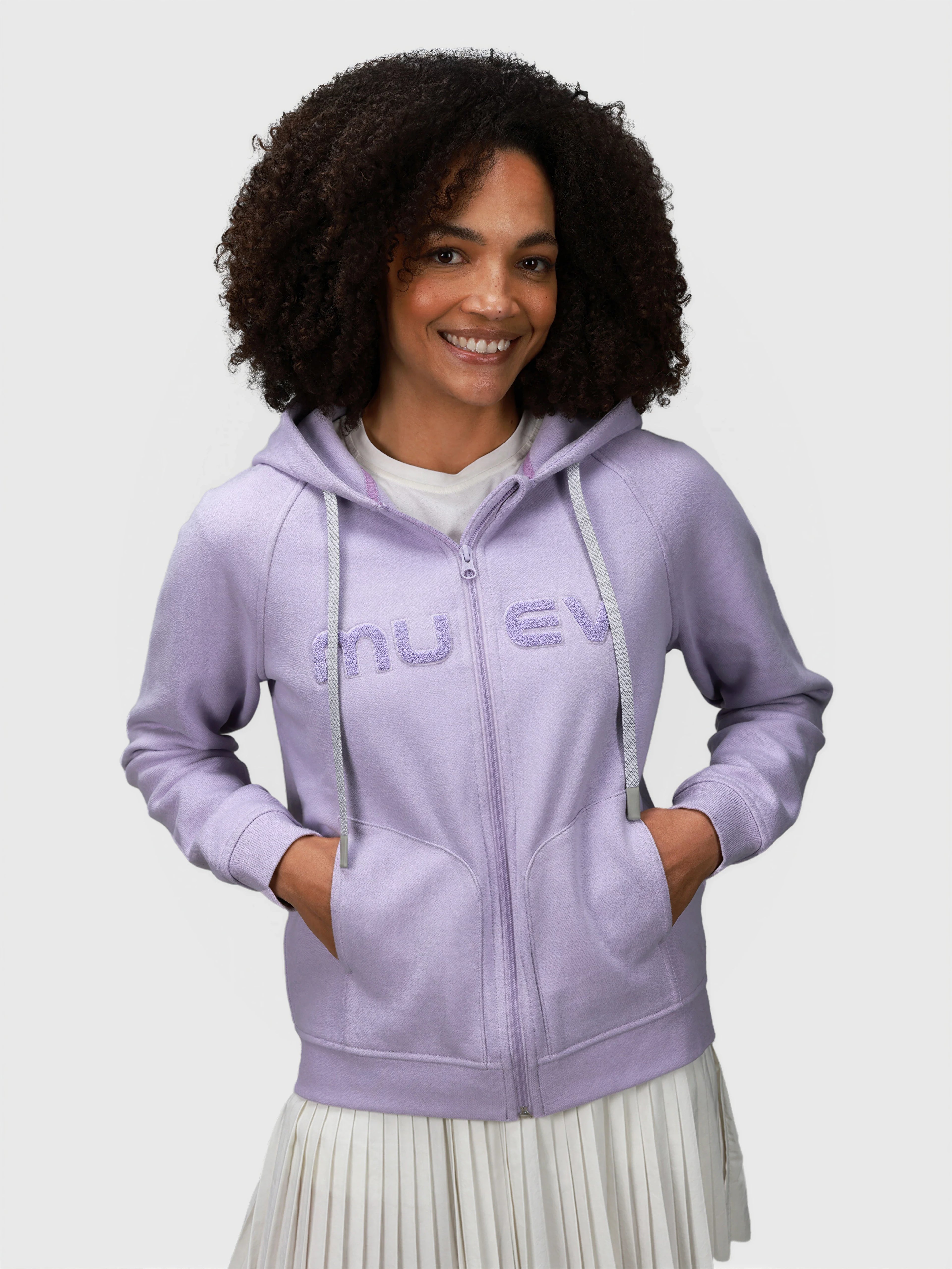 Woman smiling wearing Lilac Women's Off Court Full Zip Hoodie by MUEV for padel and pickleball clothing